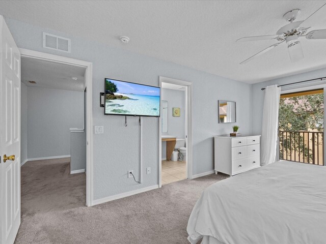 408 Miramar Ave, Davenport, FL 33897 - bedroom featuring carpet floors, a textured ceiling, baseboards, access to exterior, and a ceiling fan