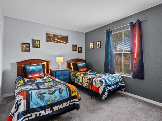 408 Miramar Ave, Davenport, FL 33897 - bedroom featuring carpet flooring, a textured wall, and baseboards