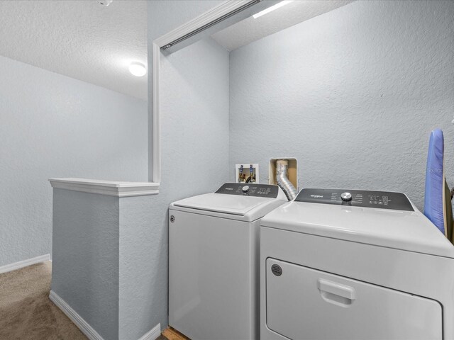 408 Miramar Ave, Davenport, FL 33897 - laundry area featuring independent washer and dryer, a textured wall, carpet, and baseboards