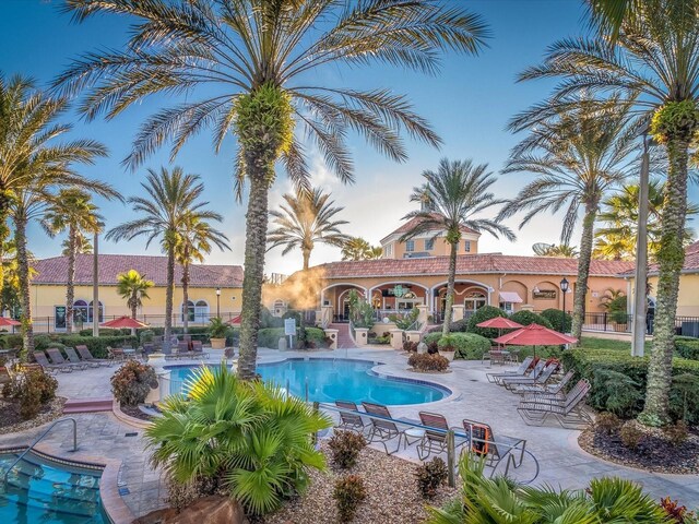 408 Miramar Ave, Davenport, FL 33897 - community pool featuring a patio area
