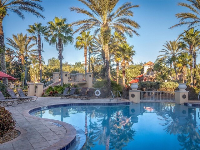 408 Miramar Ave, Davenport, FL 33897 - community pool featuring a patio and stairway