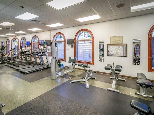 exercise room with a drop ceiling