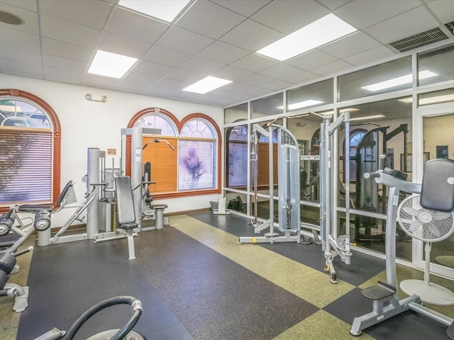 gym featuring a drop ceiling