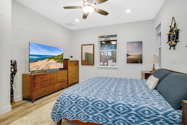 bedroom with light hardwood / wood-style flooring and ceiling fan