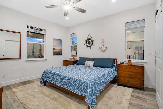 bedroom featuring hardwood / wood-style floors and ceiling fan