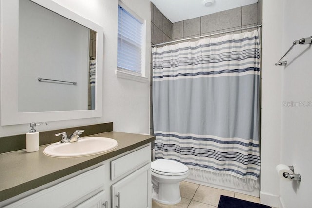 bathroom with tile patterned floors, vanity, and toilet