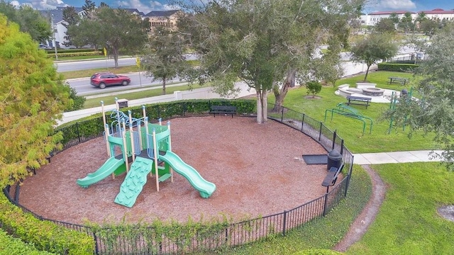 view of jungle gym featuring a lawn