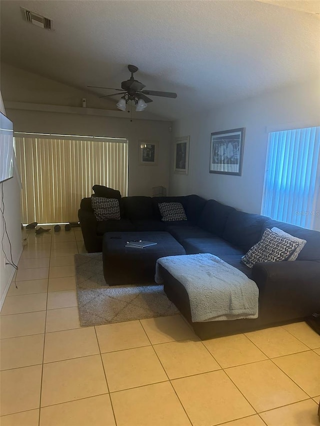 living room with light tile patterned floors and ceiling fan