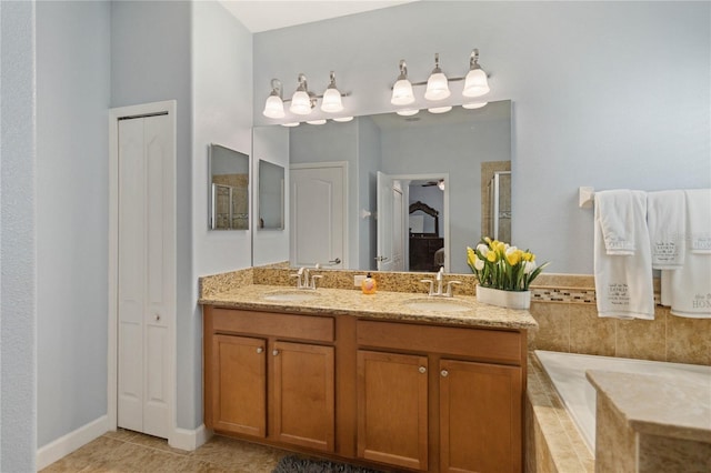 bathroom with tile patterned flooring, vanity, and walk in shower