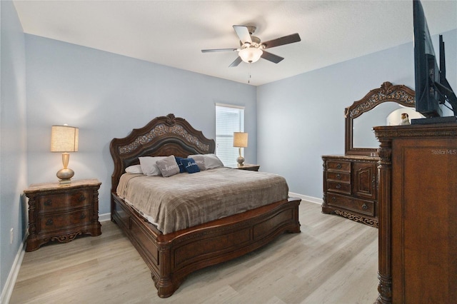 bedroom featuring ceiling fan and light wood-type flooring