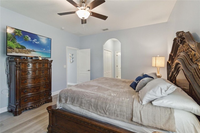 bedroom featuring a closet, ceiling fan, and light hardwood / wood-style flooring