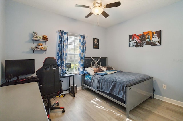 bedroom featuring hardwood / wood-style floors and ceiling fan