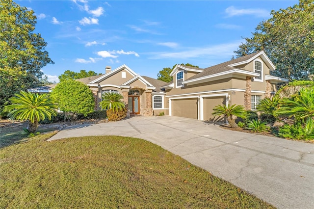 view of front facade featuring a front lawn and a garage