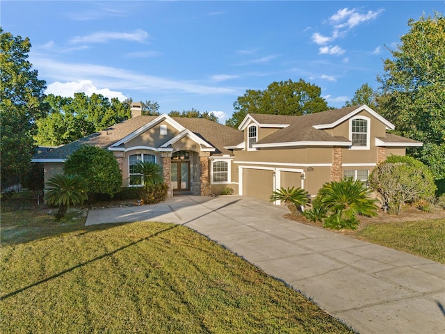 view of front facade featuring a garage and a front lawn