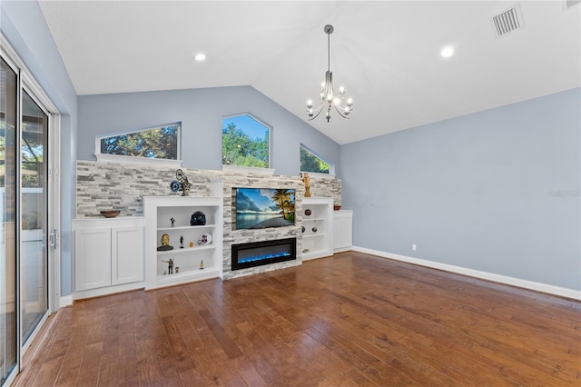 unfurnished living room featuring an inviting chandelier, wood-type flooring, and vaulted ceiling