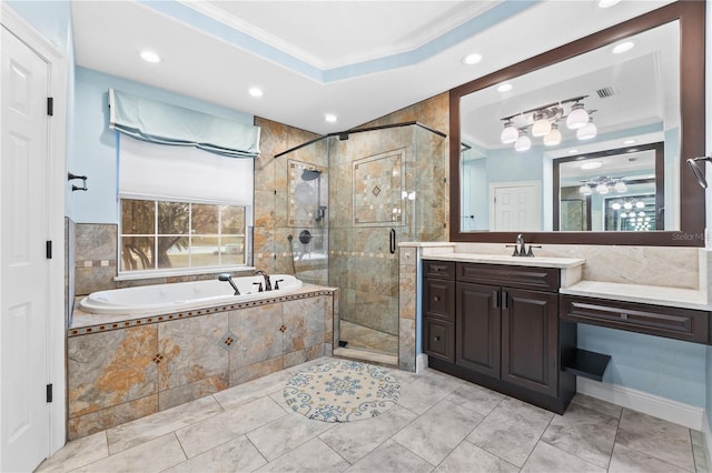 bathroom with vanity, ornamental molding, independent shower and bath, and a tray ceiling