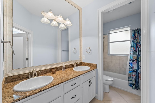 full bathroom with tile patterned flooring, shower / tub combo, vanity, and toilet