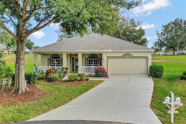 ranch-style house featuring covered porch, a garage, and a front lawn