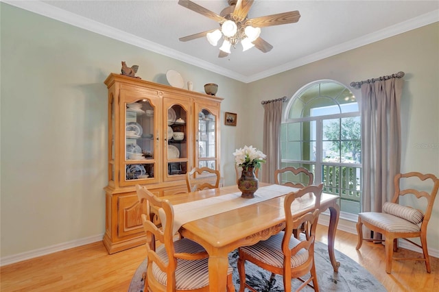 dining space with ceiling fan, light hardwood / wood-style floors, and crown molding