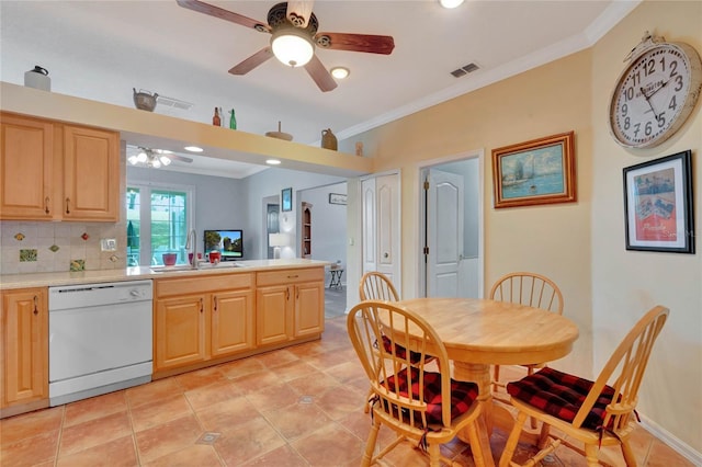 kitchen featuring light brown cabinetry, tasteful backsplash, ornamental molding, sink, and dishwasher