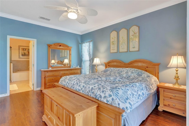 bedroom with connected bathroom, dark hardwood / wood-style floors, ceiling fan, and ornamental molding