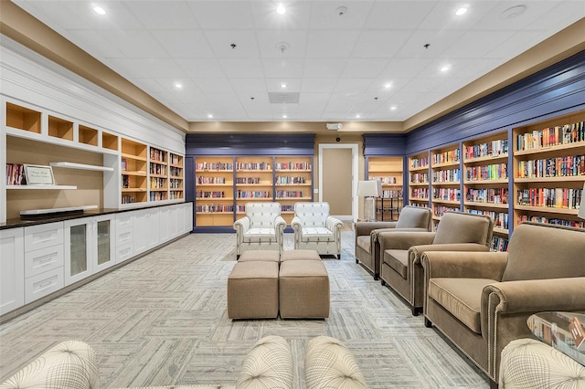 interior space with light carpet and built in features