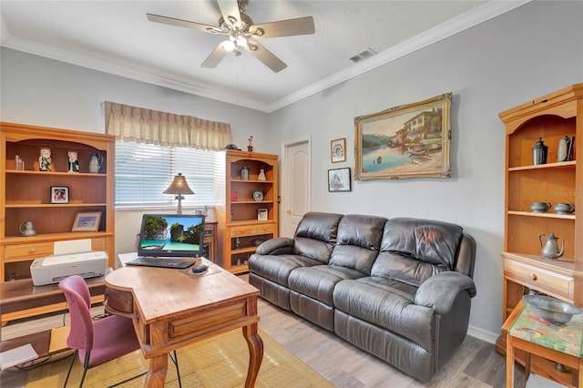 living room with light hardwood / wood-style flooring, ceiling fan, and ornamental molding