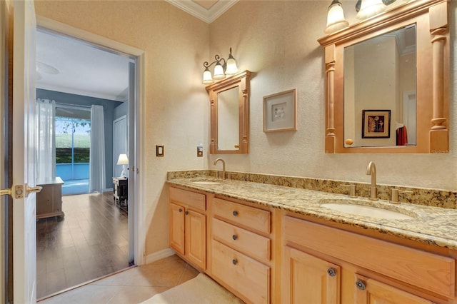 bathroom featuring hardwood / wood-style floors, vanity, and ornamental molding