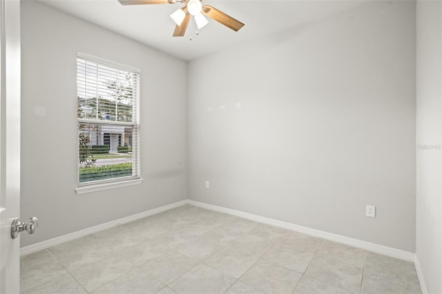 unfurnished room featuring light tile patterned floors and ceiling fan