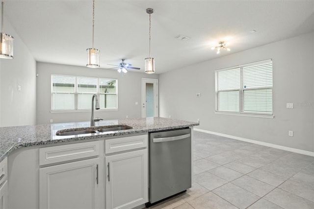 kitchen with white cabinets, light stone counters, ceiling fan, sink, and dishwasher