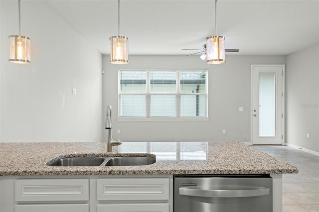 kitchen featuring dishwasher, white cabinets, sink, ceiling fan, and light stone counters