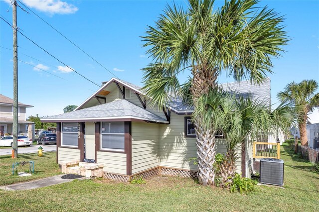 5305 S Ridgewood Ave, Port Orange, FL 32127 - view of front of house featuring a shingled roof and cooling unit