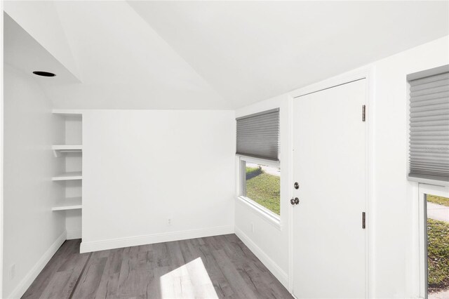 5305 S Ridgewood Ave, Port Orange, FL 32127 - interior space with wood finished floors, healthy amount of natural light, vaulted ceiling, and baseboards
