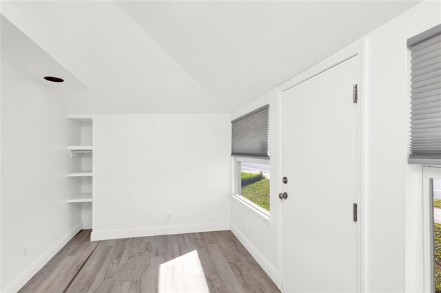 5305 S Ridgewood Ave, Port Orange, FL 32127 - interior space with wood finished floors, baseboards, and lofted ceiling