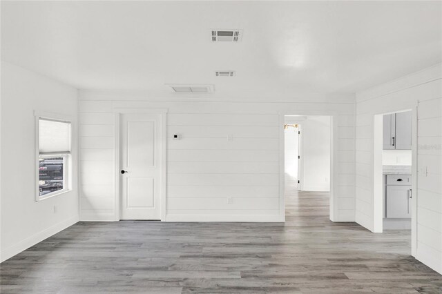 5305 S Ridgewood Ave, Port Orange, FL 32127 - unfurnished room featuring wood finished floors and baseboards