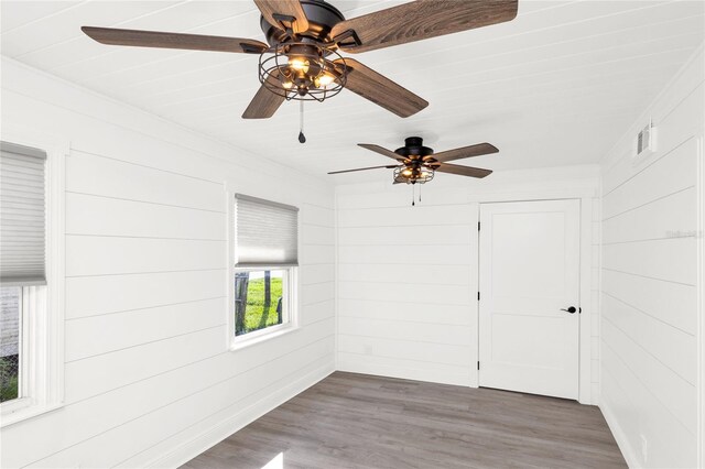 5305 S Ridgewood Ave, Port Orange, FL 32127 - spare room with ceiling fan and wood finished floors