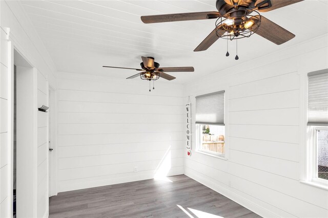 5305 S Ridgewood Ave, Port Orange, FL 32127 - spare room with ceiling fan, wood finished floors, healthy amount of natural light, and baseboards