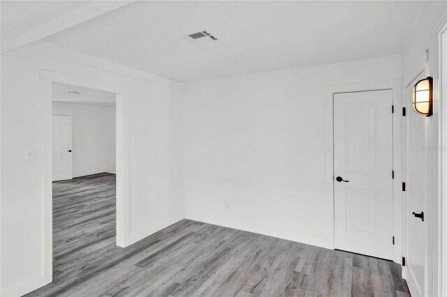 5305 S Ridgewood Ave, Port Orange, FL 32127 - spare room featuring wood finished floors and baseboards
