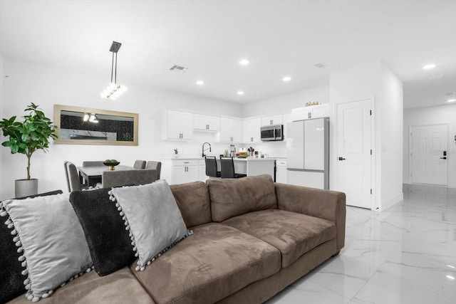 living room featuring sink