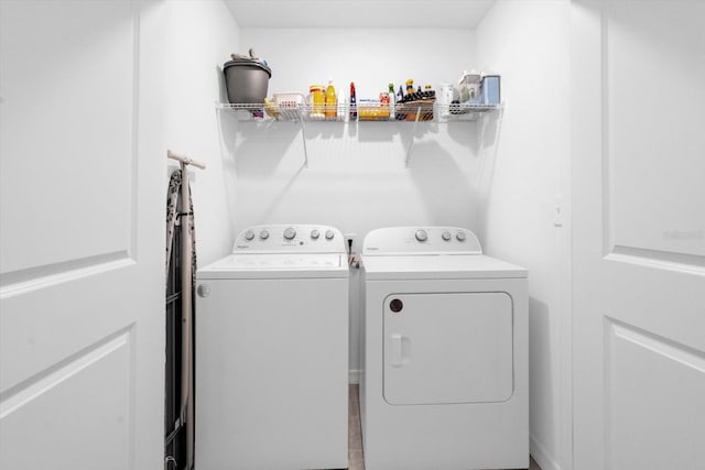 washroom featuring independent washer and dryer