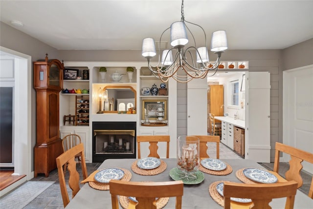 dining space with an inviting chandelier