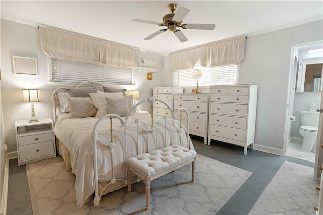 bedroom featuring dark colored carpet, ceiling fan, ornamental molding, and ensuite bath