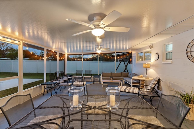 sunroom / solarium with ceiling fan