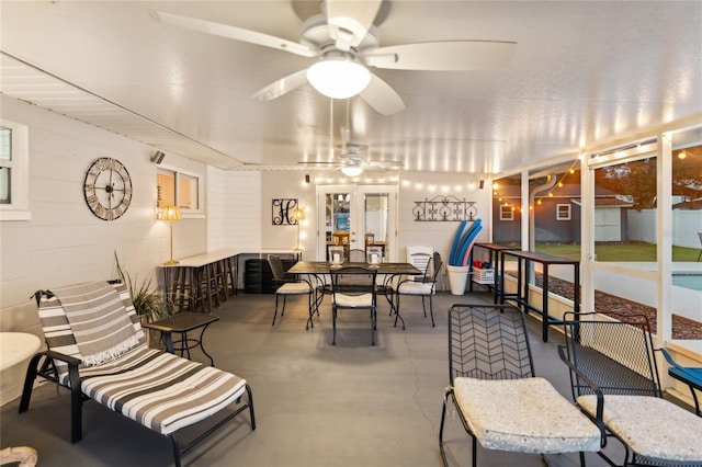 sunroom / solarium featuring ceiling fan