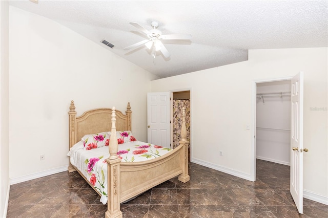 bedroom with lofted ceiling, baseboards, a spacious closet, and visible vents