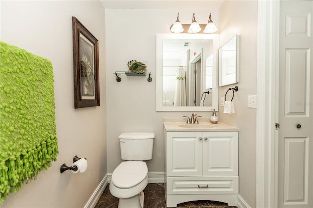 full bathroom featuring a closet, toilet, vanity, and baseboards