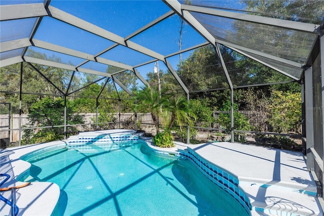 view of pool with a fenced in pool, a lanai, and a fenced backyard