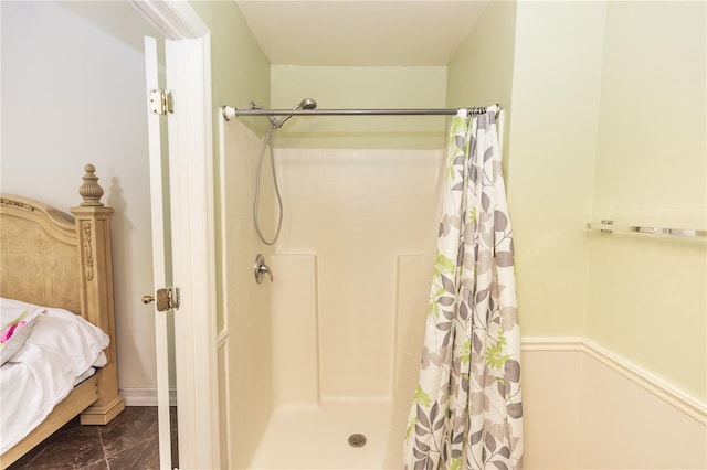 ensuite bathroom featuring connected bathroom and a shower stall