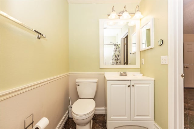 bathroom with toilet and vanity