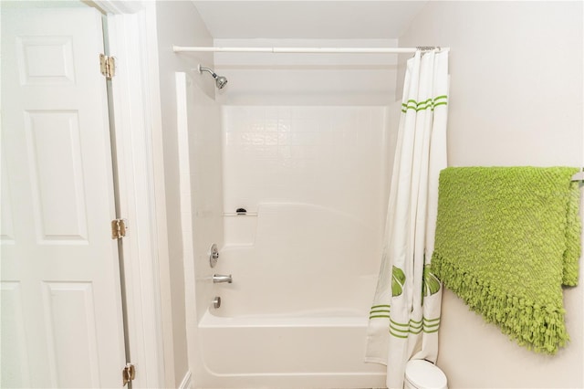 bathroom featuring shower / bath combination with curtain